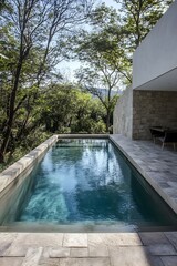 Serene Rectangular Swimming Pool in Modern Villa with Smooth Stone Tiles