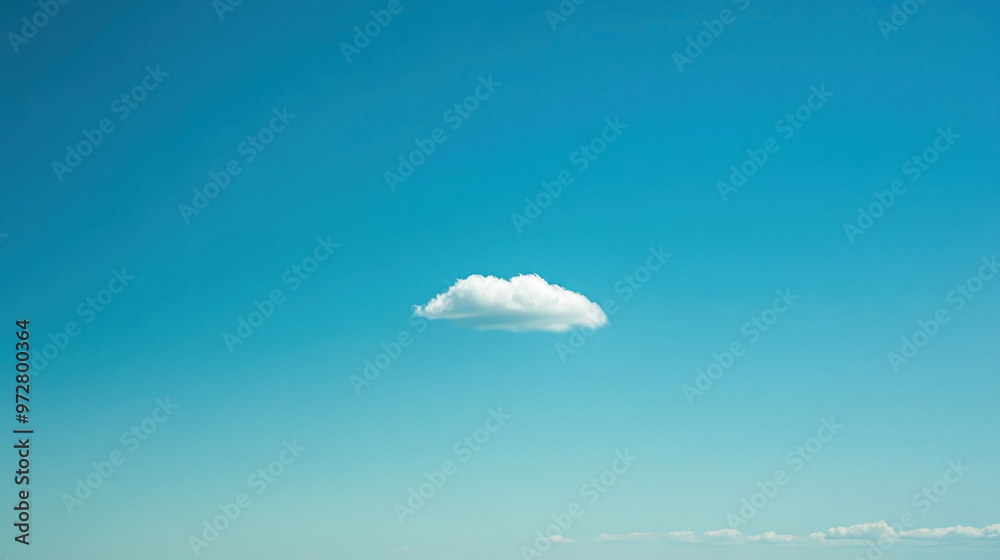 Wall mural a vast, clear blue sky with a single white cloud drifting peacefully, offering a sense of serenity a