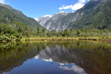 Hiking in the magical landscapes around the Franz Josef Glacier in Westland Tai Poutini National Park, New Zealand