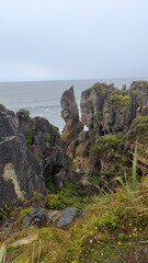 Hiking along the Punakaiki River Track and coastline in the Paparoa National Park, New Zealand