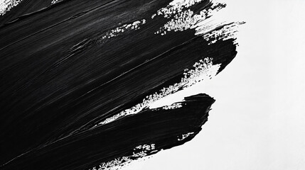 A bold black brushstroke spreads across a white canvas, creating a dynamic contrast.