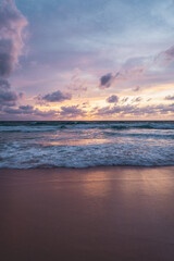 pink and orange sunset with clouds at karong beach in phuket