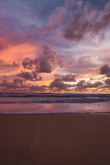 pink and orange sunset with clouds at karong beach in phuket