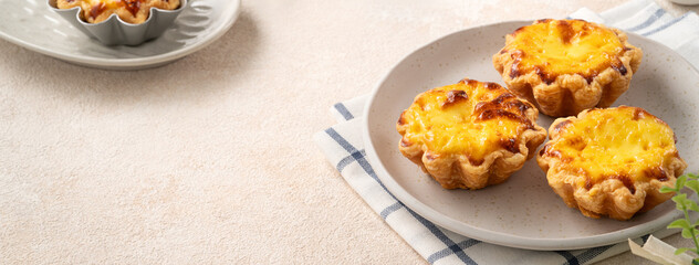 Delicious puff pastry Portuguese egg tart Pastel de nata in flower shape.