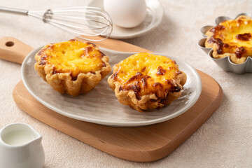 Delicious puff pastry Portuguese egg tart Pastel de nata in flower shape.