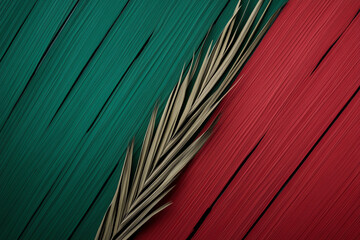 Fototapeta premium A vibrant composition featuring a palm frond against a textured background of green and red hues, perfect for artistic projects.