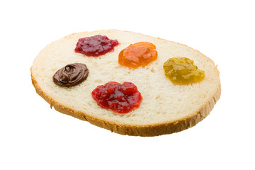 Slice of white bread with variety of jam spread on transparent background. PNG Image.