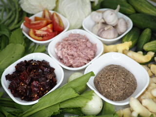 Nam Prik Ong is a Northern Thai chili dip made from ground pork, tomatoes, and a fragrant blend of garlic, shallots, dried chilies, and fermented soybean paste.