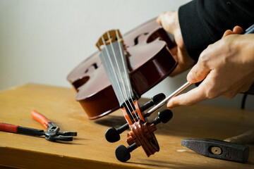 a violin being repaired
