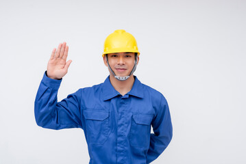 A worker in a yellow hard hat and blue coveralls raises his hand in a pledge gesture, symbolizing loyalty, honesty, and dedication to his profession. Themes of trust and integrity.