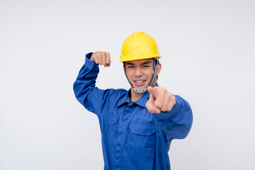 A smiling asian worker flexes his arm and points forward, confidently displaying strength and readiness. Great for promoting hard work, leadership, and confidence in the workplace