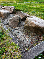 Detail of broken stones in the yard. Large stone fragments in the frame.