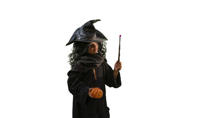 Obraz premium A child in a Halloween witch costume with a magic wand