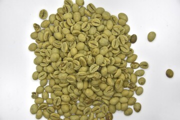 Close up Raw coffee beans on white background