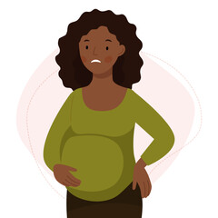 A cute african pregnant woman has a back pain. The pregnant girl is feeling bad. Pregnancy problems. 
