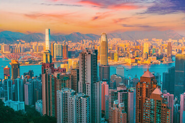 Fototapeta premium Wonderful panoramic of Hong Kong city view from Victoria Peak, modern cityscape during sunset color warm in the evening with amazing sun light.