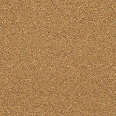 A close-up view of sandy surface with texture and grains visible