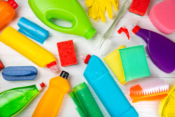 Cleaning service concept.Home cleaning product on a pink background. Bucket with household chemicals. cleaning supplies for home or office space.Early spring regular cleaning. Copy space