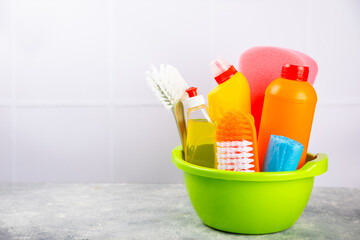 Cleaning service concept.Home cleaning product on a pink background. Bucket with household...