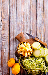 raw zucchini and patisons on board