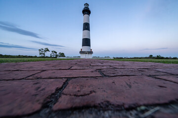 Bodie Island Lighthouse at sunset, Outer Banks, North Carolina. Low angle view