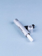 close up of car air freshener for mounting on deflector on blue background