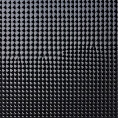 A close-up view of a black background with no objects or textures visible