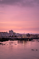 Obraz premium Castro Urdiales Spain city skyline at sunset in the atlantic