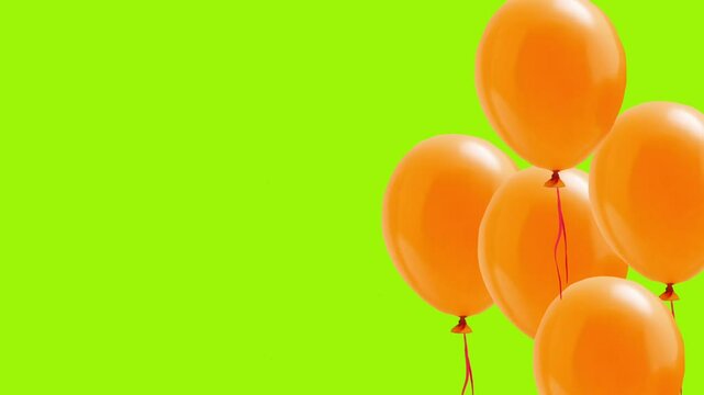  orange balloons flying up, on a green background, happy birthday background