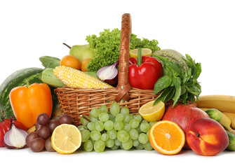 Different fresh fruits and vegetables in wicker basket isolated on white