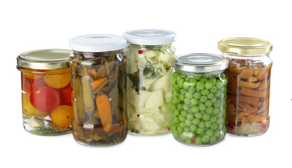 Different pickled products in jars isolated on white