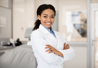 Portrait Of Beautiful Professional Black Female Stomatologist Posing In Clinic Interior, Happy...
