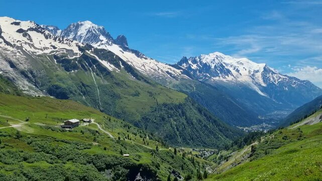 Beautiful summer view of Mont Blanc mountain range, Chamonix, Alps, France, sky, flowers, green fields
