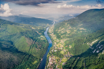 Aerial view of the Drina River winding through Tara nature park green mountains and forests in...