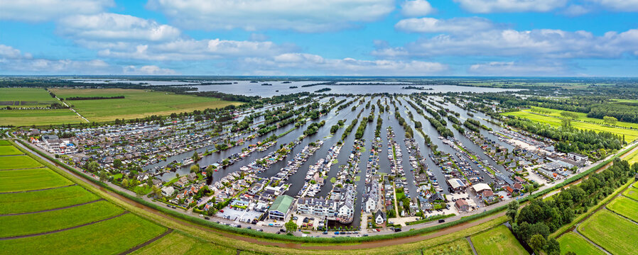 Aerial panorama from the village Scheendijk in a typical dutch watery landscape in the Netherlands