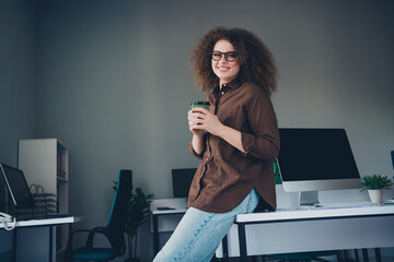 Photo of adorable charming successful woman enjoy latte tea espresso office indoors workstation...