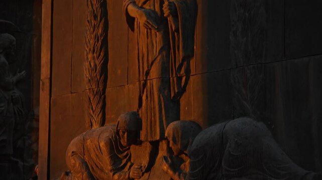 Bas-relief sculpture of Jesus Christ, with people worshipping Him, has been installed on the fa ade of the Chronicle of Georgia Monument. The sculpture is illuminated by the rays of the setting sun.