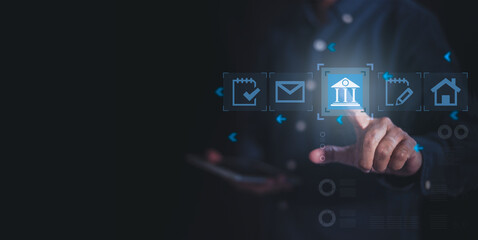 A business person interacting with digital icons on a screen, representing banking, communication, and online services.