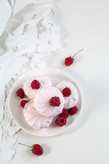 Marshmallow cookies with fresh raspberries for tea, selective focus