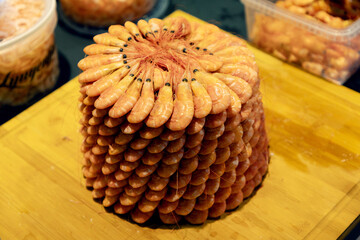 Healthy food. Fresh shrimps on plate on light background top view