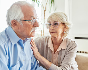 support woman man problem care couple senior mature wife husband female depression sad consoling help male family unhappy grief together worried love