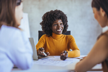 Collaborative Business Meeting with Diverse Team Members Smiling
