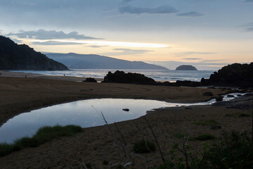 Sunset Breaking Through Clouds at Laga Beach, Basque Country