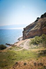 Beautiful rough blue sea with waves and sandy beach. Beautiful day in Greece	
