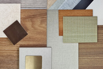 Fototapeta premium interior design material board in close up view for architecture or house decoration consists of wooden vinyl flooring tiles, stone tile, quartz, gold stainless, veneer, draperies, fabric laminated.