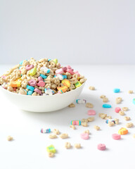 Colorful Cereal with Marshmallow Shapes in a White Bowl on a Bright Background