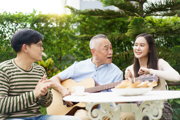 Happy multi-generation Asian family living together in weekend