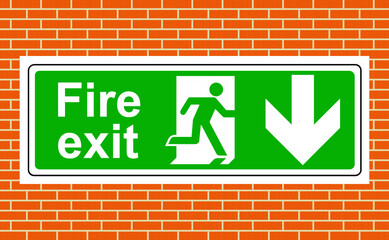 Obraz premium Fire exit down sign on a wall