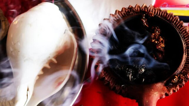 Slow Motion Burning Censer in Hindu Temple during Navratri festival at home in rural India. Faith trust hope concept.