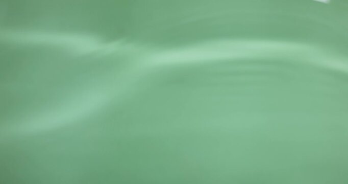 wavy water surface on green background